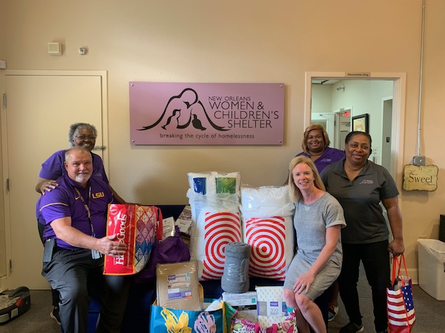 Coffee for a Cause August 2019 Photo of faculty and staff with donations for a shelter